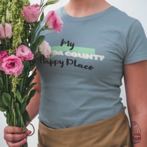 closeup-mockup-of-a-woman-wearing-a-t-shirt-while-holding-a-bouquet-of-flowers