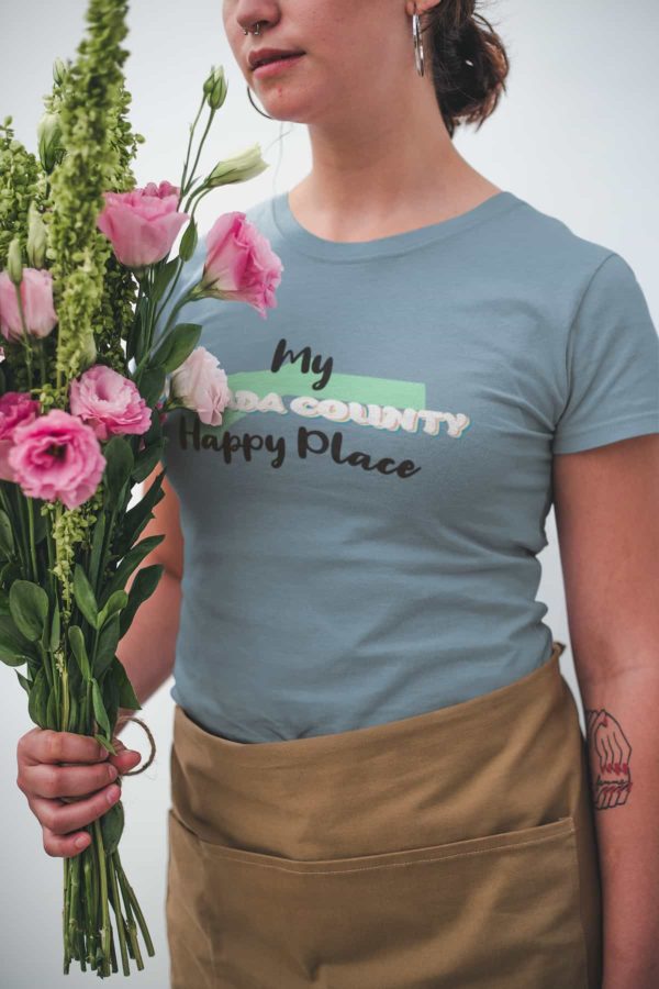 closeup-mockup-of-a-woman-wearing-a-t-shirt-while-holding-a-bouquet-of-flowers