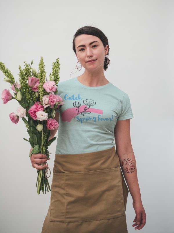 t-shirt-mockup-of-a-woman-holding-a-flower-bouquet